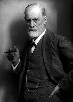 Photo of Sigmund Freud with a cigar, wearing a suit